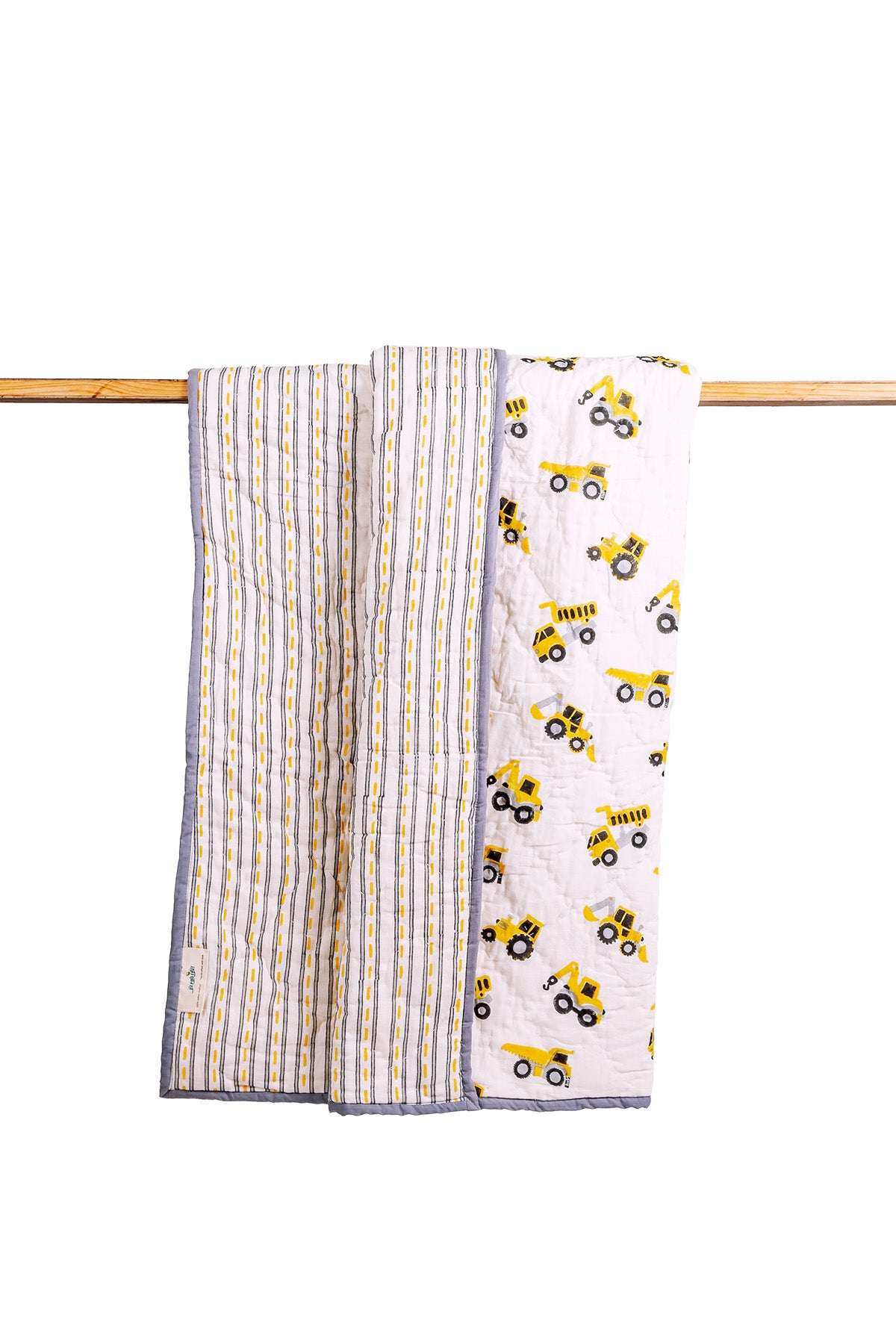 Reversible construction truck print mulmul quilt with striped back, hand block printed in yellow and grey