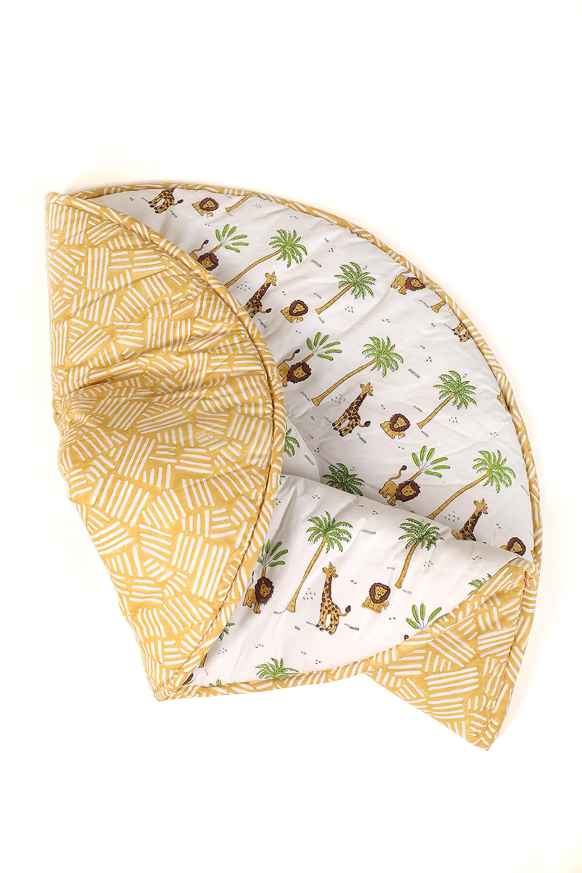 Folded forest print cotton playmat showing extra padding