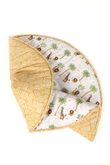 Folded forest print cotton playmat showing extra padding