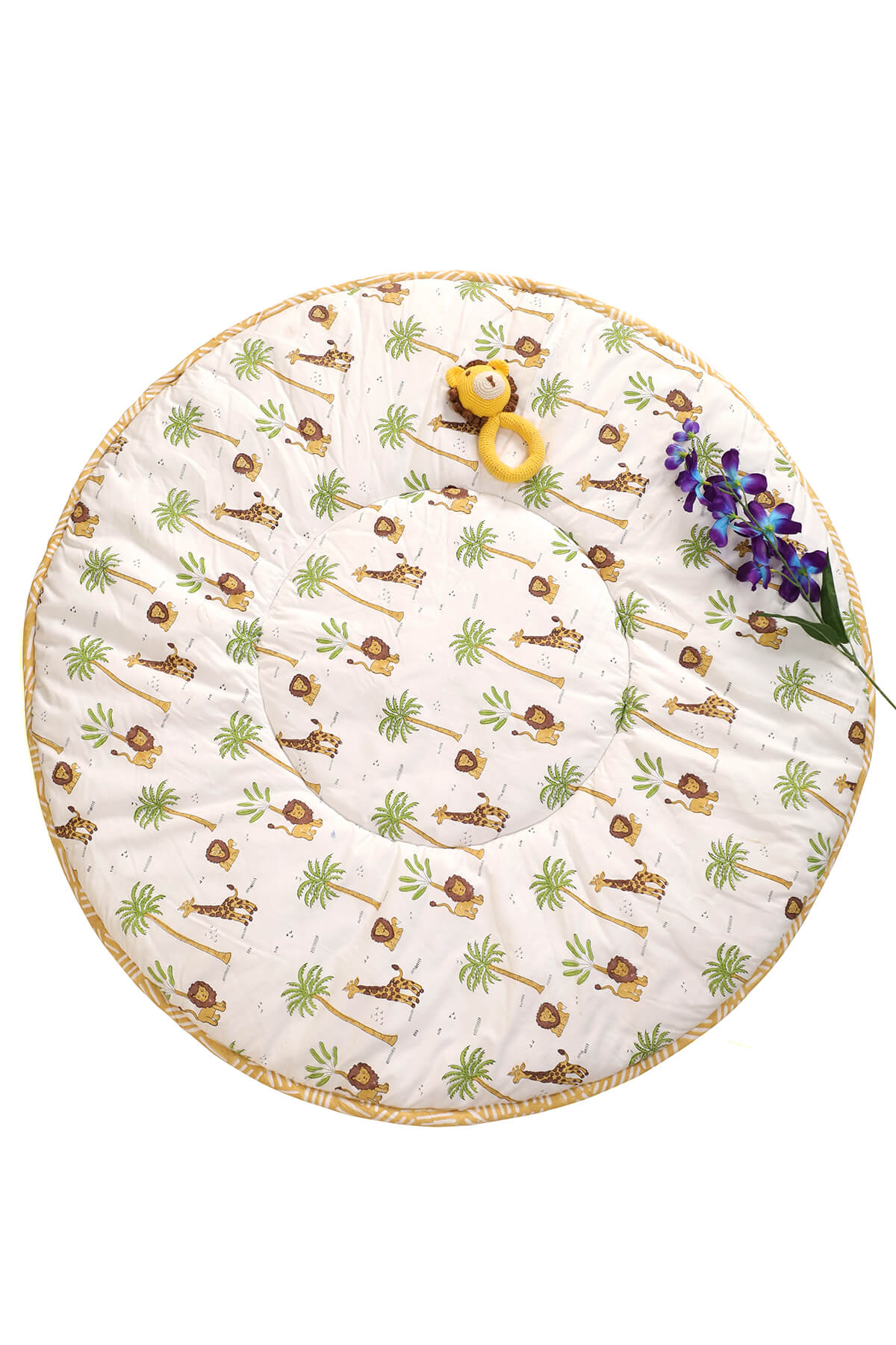 Close-up of hand block printed forest design on soft cotton baby playmat