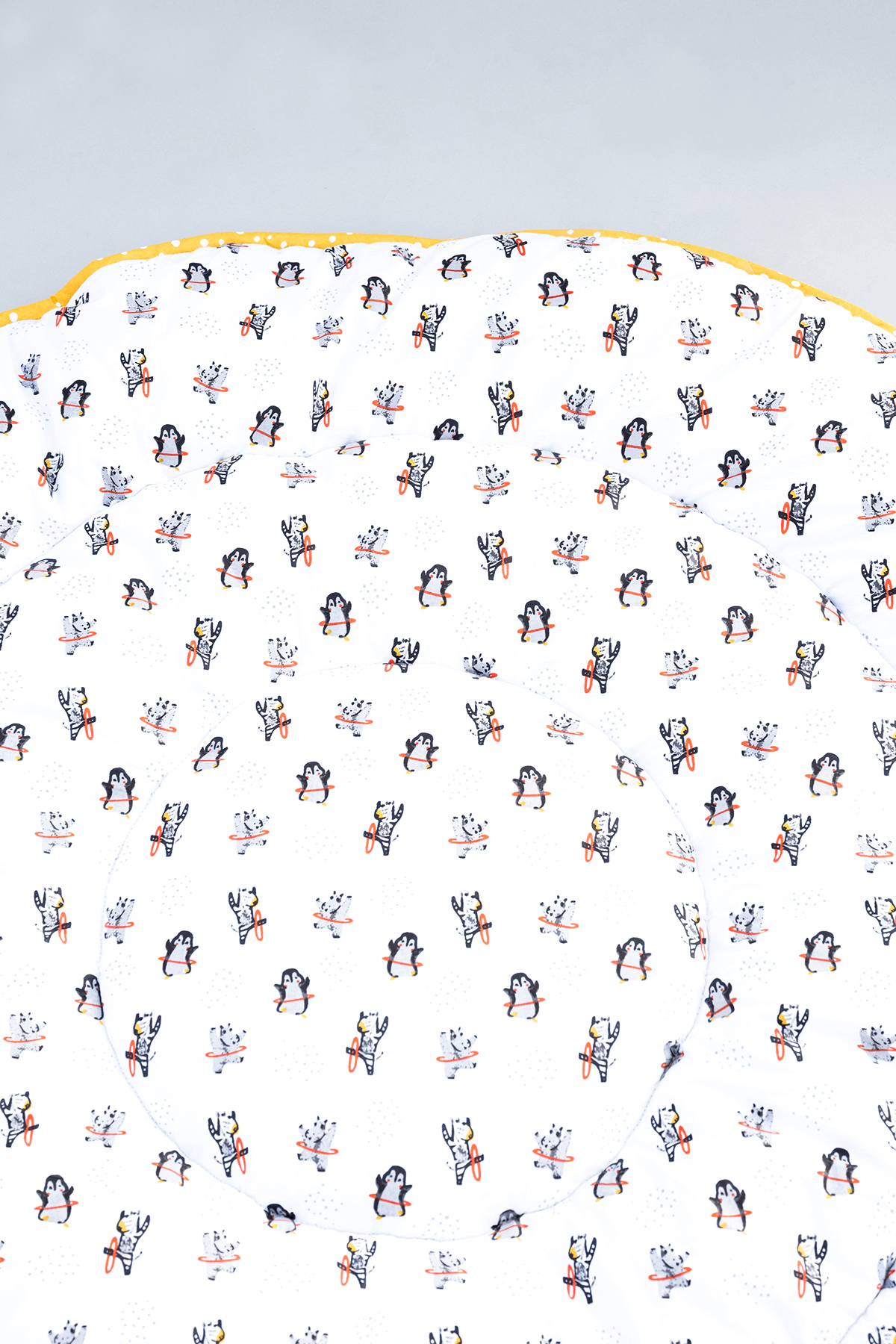Close-up of screen printed hula hoop design on soft padded cotton playmat