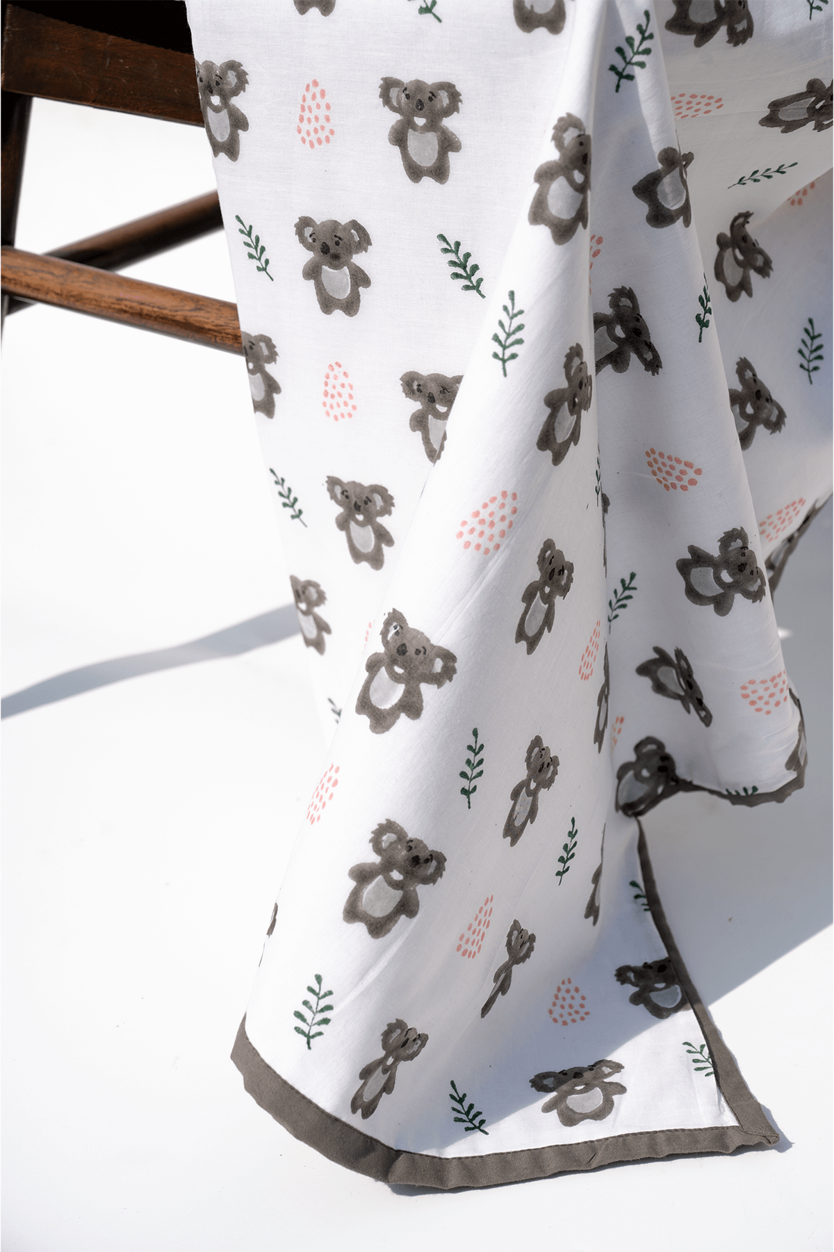 Close-up of koalas hand block printed on soft cotton mulmul dohar