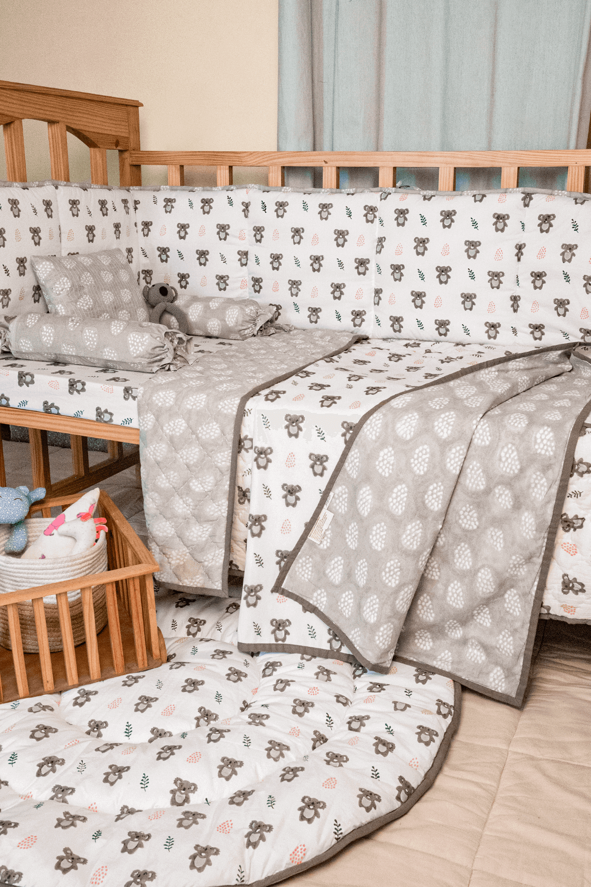 Reversible koala Hand Block  print cotton mulmul dohar in a crib setting 