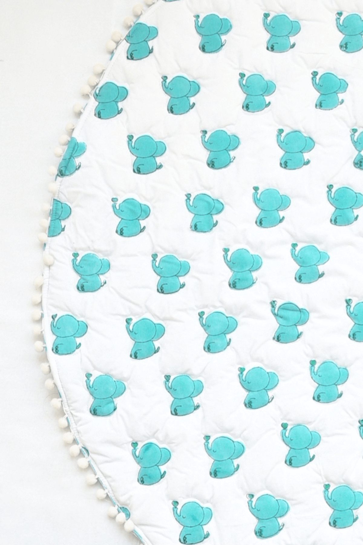 Reversible blue elephant padded cotton playmat showing the reverse side
