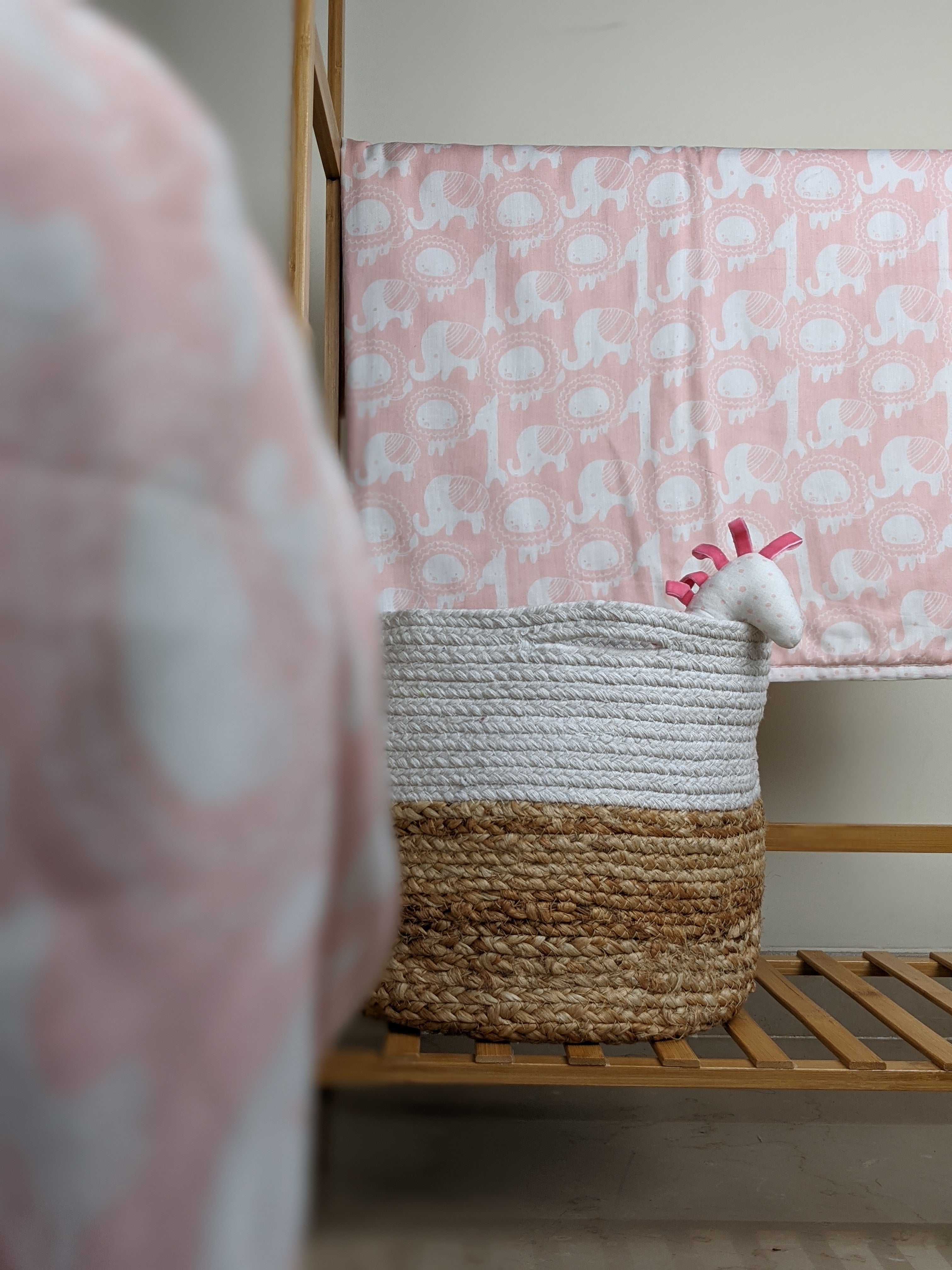 Reversible pink jungle safari print cotton mulmul dohar showing the front and reverse sides