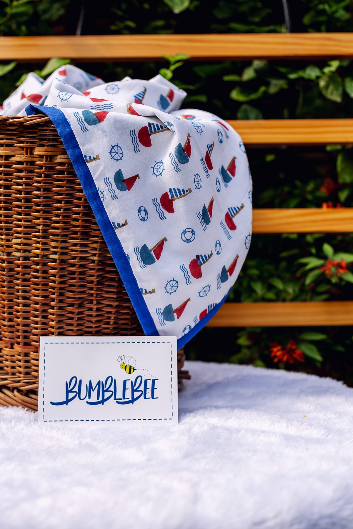 Detail of Bumblebee label and soft cotton mulmul fabric on Sail Away kids dohar