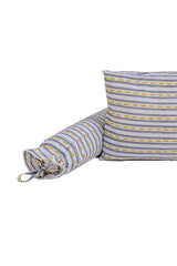 Close-up of road stripe print cotton baby bolster with tie-up ends beside matching pillow